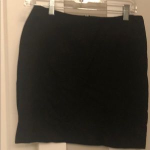 Black skirt . Fake pockets in back . Worn once